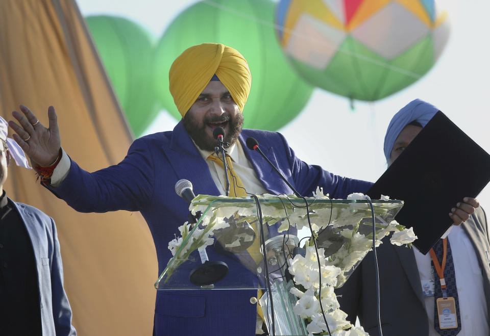 Indian cricketer turned politician Navjote Singh Sidhua addresses during the inauguration ceremony of Gurdwara Darbar Sahib in Kartarpur, Pakistan, Saturday, Nov. 9, 2019. Pakistan's prime minister Imran Khan has inaugurated a visa-free initiative that allows Sikh pilgrims from India to visit one of their holiest shrines. Khan opened the border corridor on Saturday as thousands of Indian pilgrims waited to visit the Kartarpur shrine. (AP Photo/K.M. Chaudary)