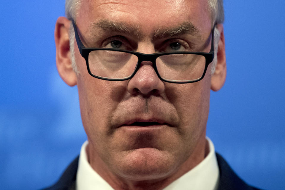 FILE - In this Sept. 29, 2017 file photo, then Interior Secretary Ryan Zinke speaks on the Trump Administration's energy policy at the Heritage Foundation in Washington. As former U.S. Interior Secretary Zinke departs Trump’s Cabinet amid a cloud of investigations, he says he’s lived up to the conservation ideals of Teddy Roosevelt and insists the myriad allegations against him are unfounded. Zinke told The Associated Press that he quit President Donald Trump’s Cabinet on his own terms, despite indications he was pressured by the White House to resign effective Wednesday, Jan. 2, 2019. (AP Photo/Andrew Harnik, File)