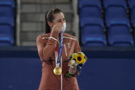 Gold medalist Belinda Bencic, of Switzerland, wipes a tear during the medal ceremony for women's singles of the tennis competition at the 2020 Summer Olympics, Sunday, Aug. 1, 2021, in Tokyo, Japan. (AP Photo/Seth Wenig)