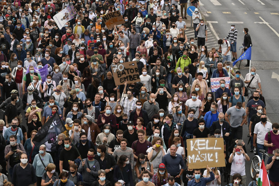 Demonstrators protesting against the dismissal of the editor-in-chief of the Hungarian news website Index.hu march in the streets of Budapest, Hungary, Friday, July 24, 2020.Dozens of journalists are resigning from Hungary's main news site because of the firing earlier this week of their editor-in-chief. Over 80 Index staff members said Friday were leaving Index.hu because the dismissal of Szabolcs Dull endangers the website's professional independence and its future. (Zsolt Szigetvary/MTI via AP)