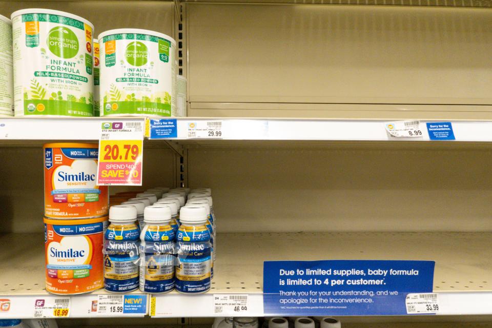 A small amount of baby formula is displayed on the shelves of a grocery store with a sign limiting purchases in Indianapolis on May 10, 2022. Parents across the U.S. are scrambling to find baby formula because supply disruptions and a massive safety recall have swept many leading brands off store shelves.