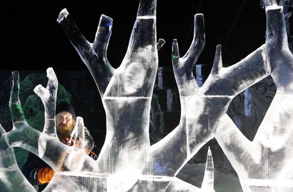 Sculptor Partanen of Finland carves a sculpture at the Brussels Ice Magic Festival