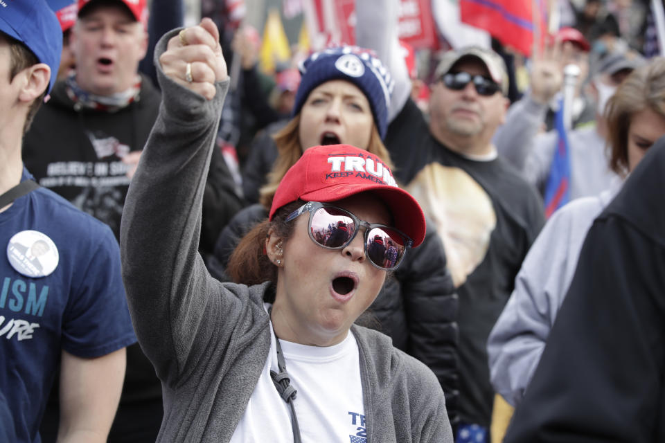 Supporters of President Donald Trump attend a rally at Freedom Plaza, Saturday, Dec. 12, 2020, in Washington. (AP Photo/Luis M. Alvarez)