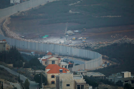 FILE PHOTO: Israeli drilling equipment is seen next to the border with Lebanon, near the Lebanese village of Kfar Kila, seen from the Israeli side December 4, 2018. REUTERS/Ronen Zvulun/File Photo