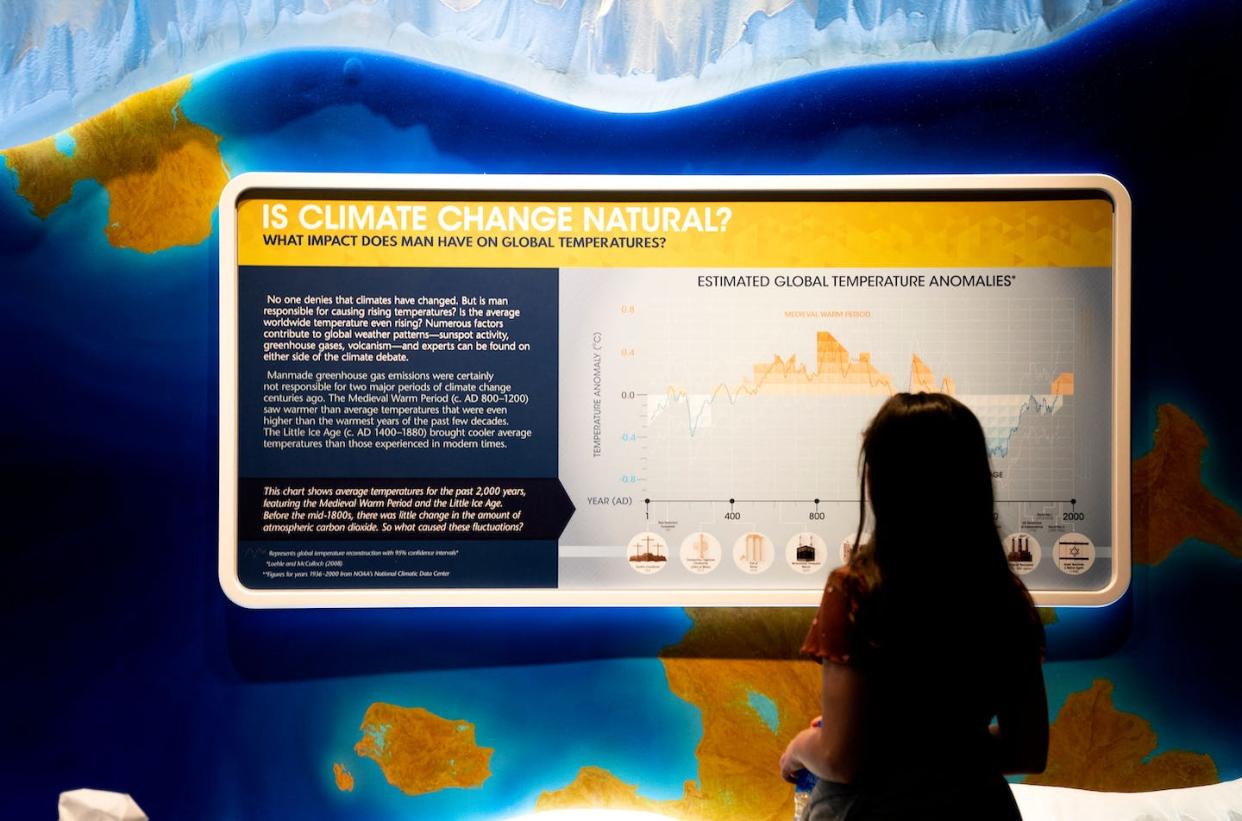 A display questioning humans' role in climate change, at the Ark Encounter in Williamstown, Ky. <a href="https://www.gettyimages.com/detail/news-photo/child-looks-at-a-display-questioning-humans-role-in-climate-news-photo/1244059010?phrase=climate%20evangelical%20religion%20%20united%20states&adppopup=true" rel="nofollow noopener" target="_blank" data-ylk="slk:Stefani Reynolds/AFP via Getty Images;elm:context_link;itc:0;sec:content-canvas" class="link ">Stefani Reynolds/AFP via Getty Images</a>