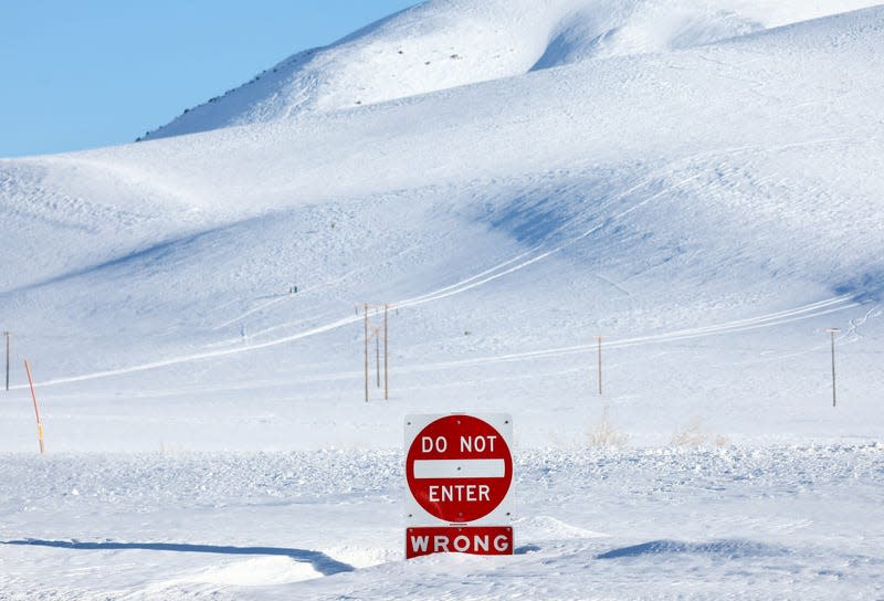 A traffic sign buried in snow in Mammoth Lakes, CA.