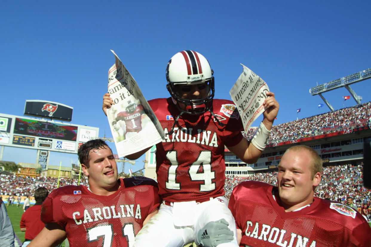 1 Jan 2002:  South Carolina quarterback Phil Petty, #14, is carried off the field by teammates after beating Ohio State 31-28 in the Outback Bowl at Raymond James Stadium in Tampa, Florida. DIGITAL IMAGE. Mandatory Credit: Scott Halleran/Getty Images