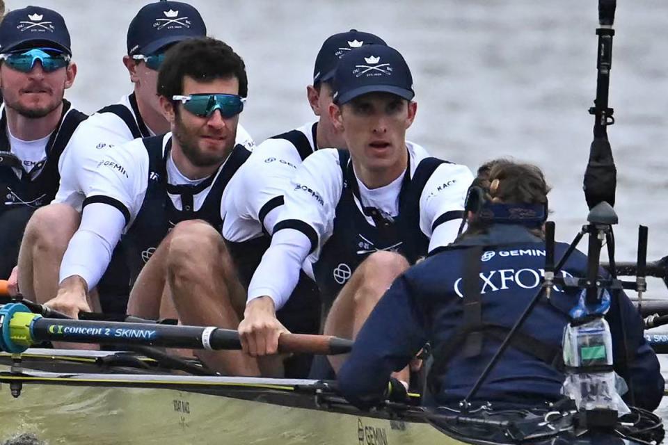 ROWING-GBR-BOAT RACE: Anna O'Hanlon (cox), Felix Drinkall (stroke), Tassilo von Mueller, Jean-Philippe Dufour, James Doran and Tom Sharrock row in the Oxford boat (AFP via Getty Images)