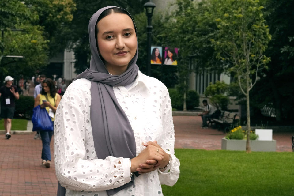 Northeastern University student Mashal Aziz poses on campus, Friday, July 21, 2023, in Boston. Aziz was just months away from graduating from college in Afghanistan when she found herself rushing to the airport to leave the country as the Taliban swept into power. Universities and colleges across the U.S. have scrambled to find ways to help students, like Aziz, to continue their education. (AP Photo/Charles Krupa)