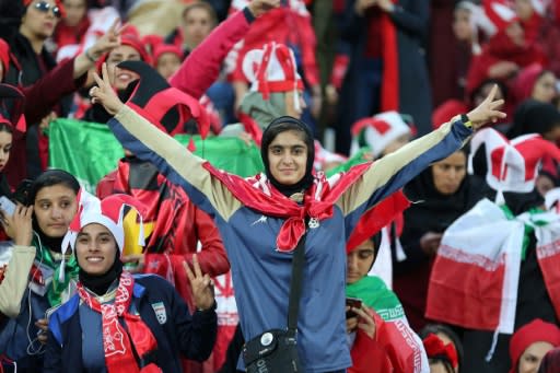 Iranian female fans cheer for their team during the second leg of the AFC Champions League final football match between Iran's Persepolis and Japan's Kashima Antlers on November 10, 2018, at the Azadi Stadium in Tehran