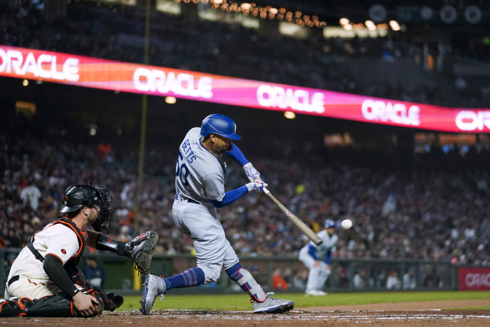 Los Angeles Dodgers' Mookie Betts hits an RBI double against the San Francisco Giants during the fourth inning of a baseball game in San Francisco, Wednesday, April 12, 2023. (AP Photo/Godofredo A. Vásquez)