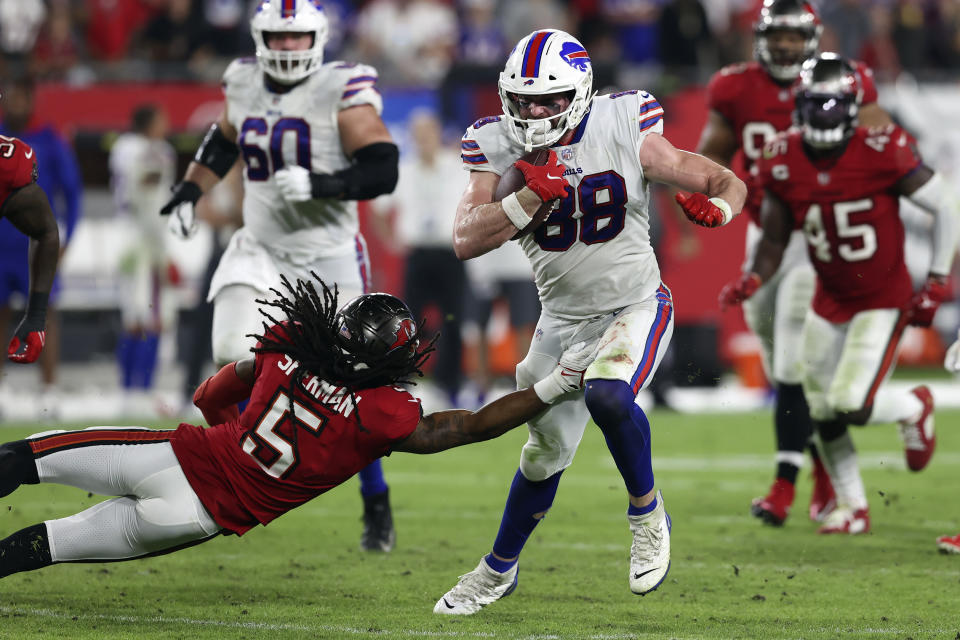 Buffalo Bills tight end Dawson Knox (88) slips a tackle by Tampa Bay Buccaneers cornerback Richard Sherman (5) during the second half of an NFL football game Sunday, Dec. 12, 2021, in Tampa, Fla. (AP Photo/Mark LoMoglio)