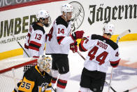 New Jersey Devils' Nathan Bastian (14) celebrates his goal during the third period of an NHL hockey game against the Pittsburgh Penguins in Pittsburgh, Tuesday, April 20, 2021. (AP Photo/Gene J. Puskar)