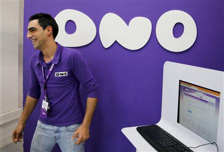 An employee smiles at an Ono shop in Leganes, near Madrid, March 17, 2014. REUTERS/Paul Hanna