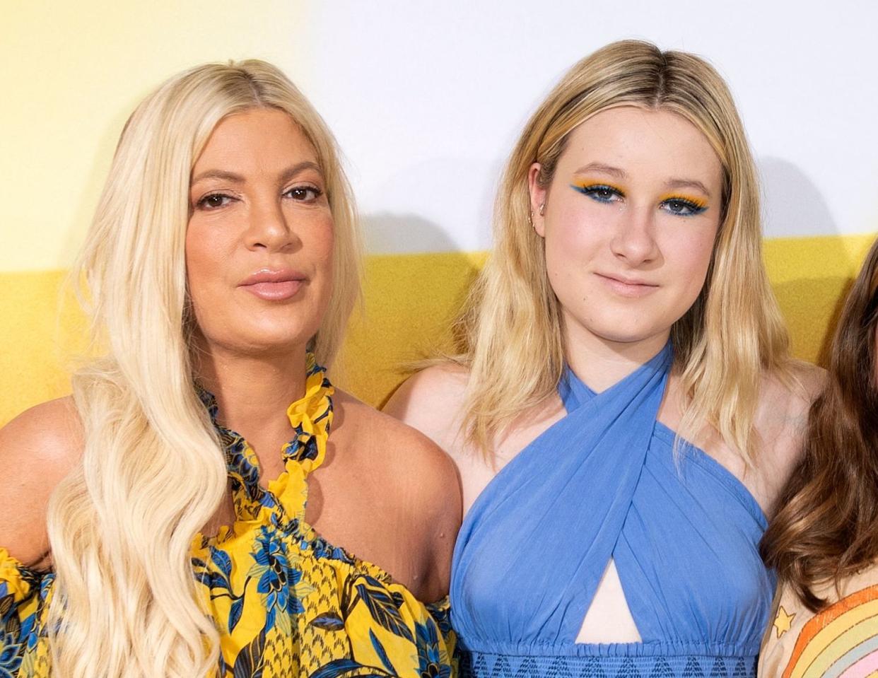 Tori Spelling (left) shared that her 14-year-old daughter, Stella, was hospitalized following a hemiplegic migraine. (Photo by Valerie Macon/AFP via Getty Images)