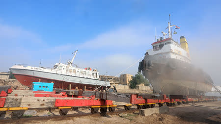 Workers repair an Iraqi ship at a shipyard built by the British Army on Basra's docks in 1918, in Basra, Iraq December 23, 2018. REUTERS/Essam al-Sudani