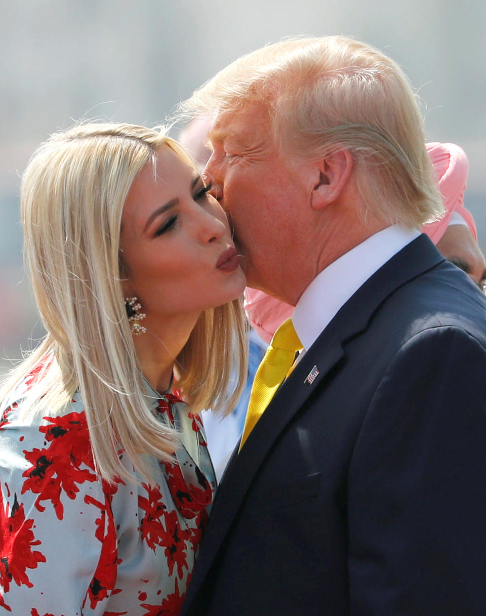 U.S. President Donald Trump kisses U.S. White House senior advisor Ivanka Trump as they arrive at Sardar Vallabhbhai Patel International Airport in Ahmedabad, India February 24, 2020. REUTERS/Al Drago