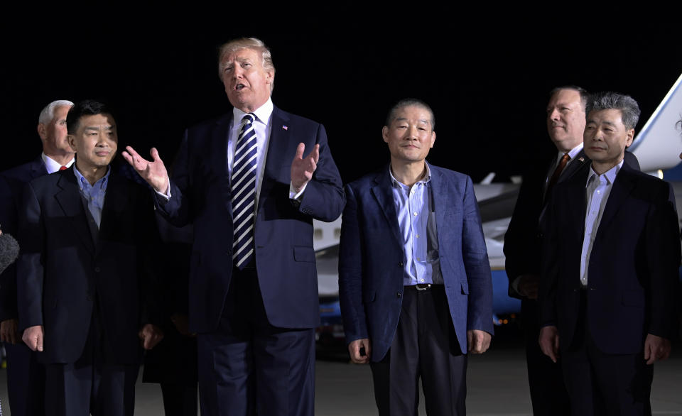 President Trump speaks as he stands with Tony Kim, left, Kim Dong-chul, center right, and Kim Hak-song, right, after they arrived at Andrews Air Force Base early Thursday morning. Vice President Mike Pence, far left, and Secretary of State Mike Pompeo, second from right, look on. (Photo: Susan Walsh/AP)