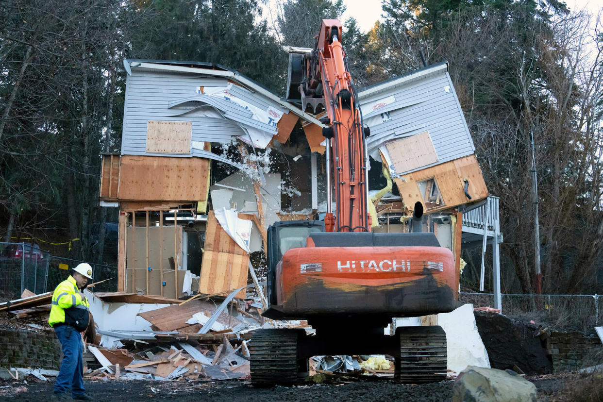 Heavy equipment is used to demolish the house where four University of Idaho students were killed. (Ted S. Warren / AP)