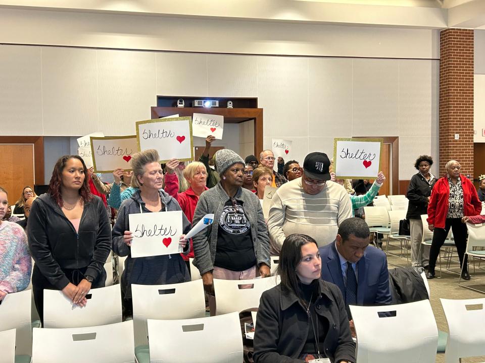 Advocates for Petersburg's homeless stand during a presentation at a City Council work session Tuesday, Feb. 6, 2024, at the Petersburg Public Library.