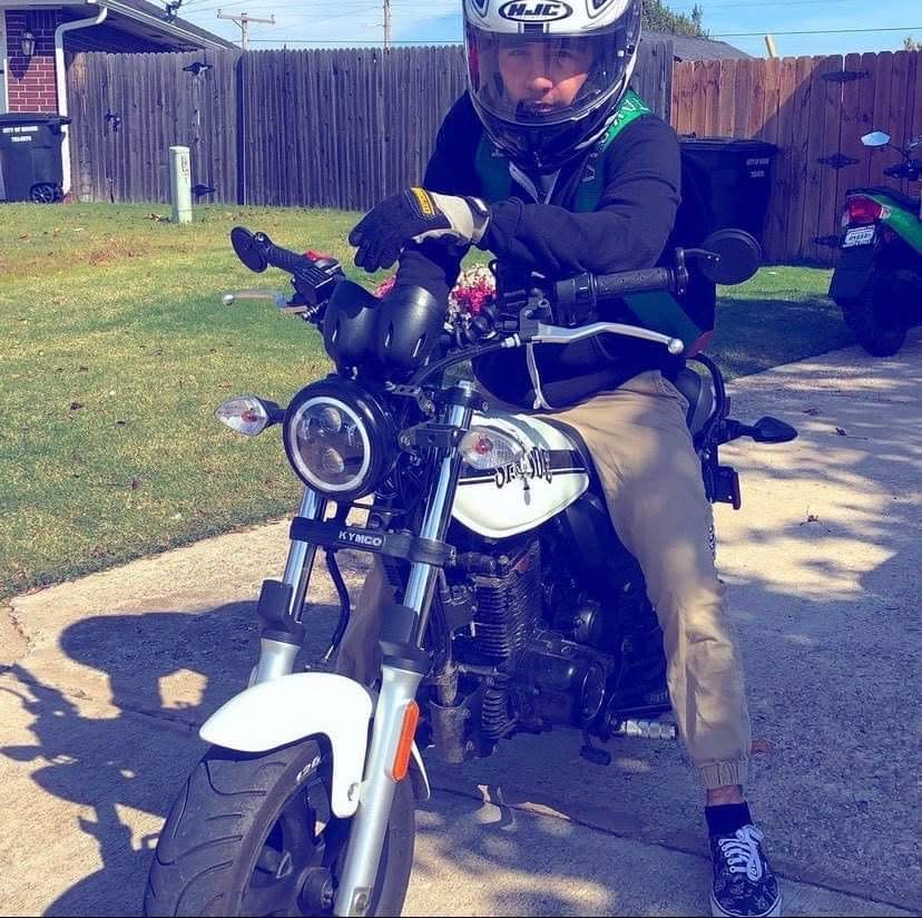 Kolby Dutton, 16 at the time of this Thanksgiving photo provided by family members, poses with his beloved motorcycle. Dutton died Thursday at the age of 17 after a fatal collision near Westmoore High School.