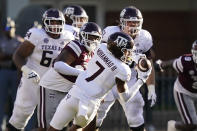 Texas A&M wide receiver Moose Muhammad III (7) pulls down a pass reception behind the Mississippi State defense during the second half of an NCAA college football game in Starkville, Miss., Saturday, Oct. 1, 2022. (AP Photo/Rogelio V. Solis)