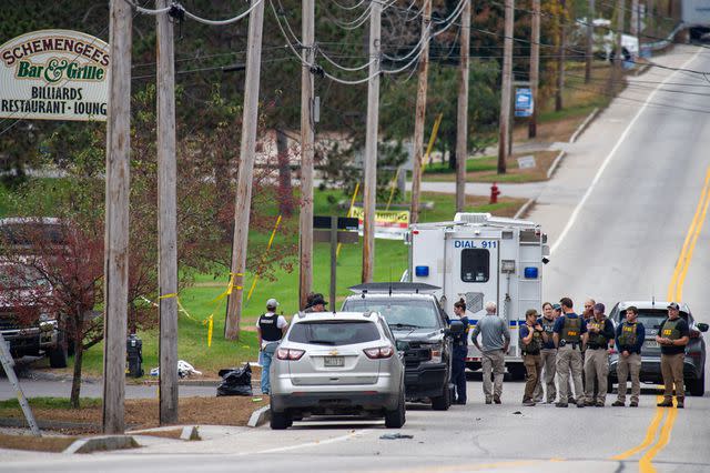 <p>JOSEPH PREZIOSO/AFP via Getty </p> Site of mass shooting outside of Schemengees Bar in Maine on Oct. 26