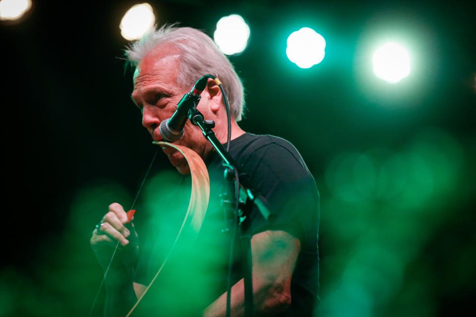 John Dillon of The Ozark Mountain Daredevils plays a mouth bow during Springfield's second annual Earth Day Music and Sustainability Festival, at Jordan Valley Ice Park on Saturday, April 22, 2023.