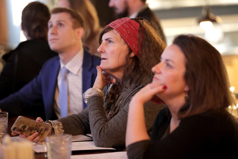 People watch the vote count on a television monitor at a bar near Capitol Hill in Washington. Source: AP Photo/Julio Cortez