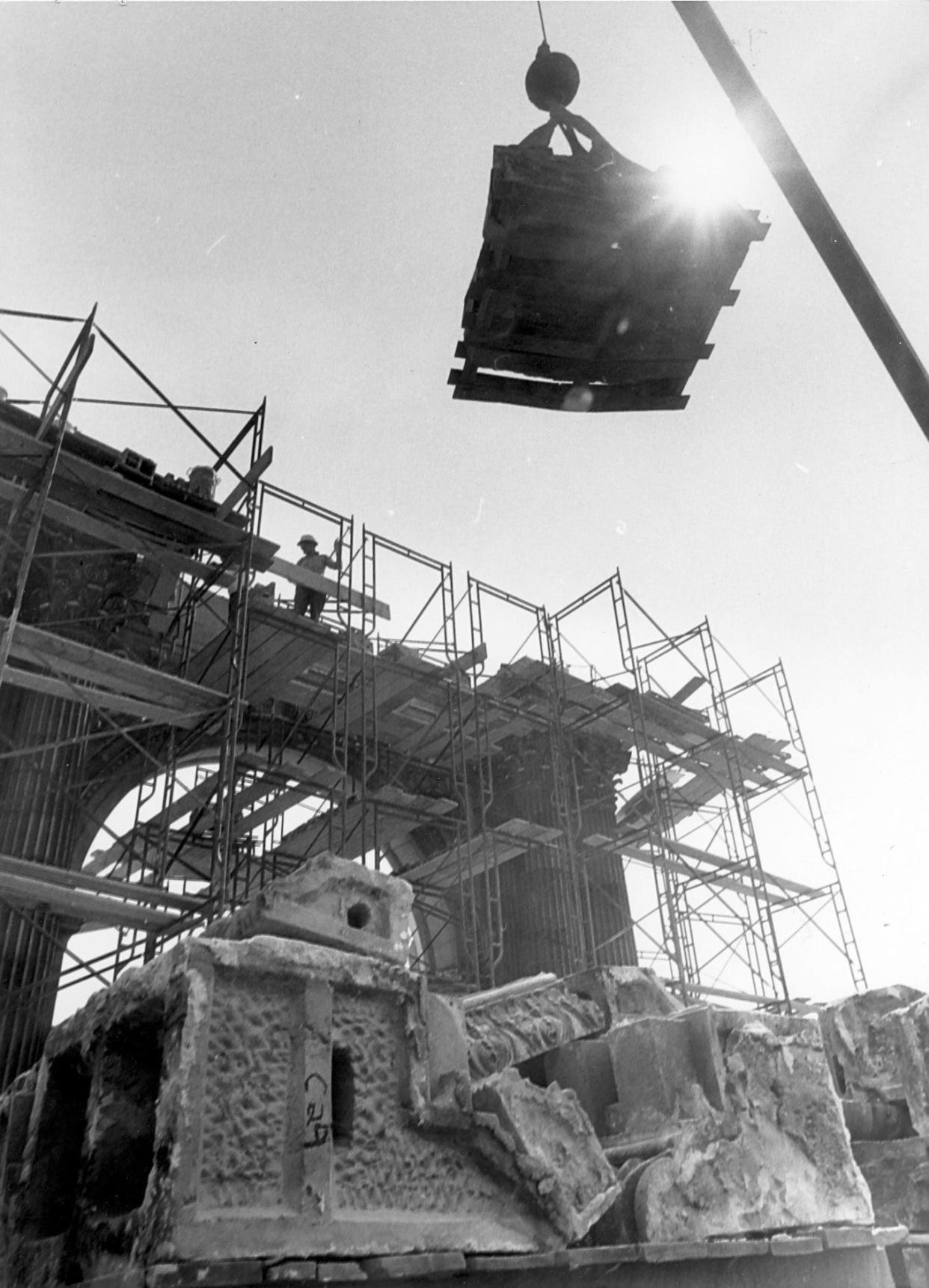 In this black and white file photo, Union Station Arch is taken apart for later reconstruction in a new location in April 1977.