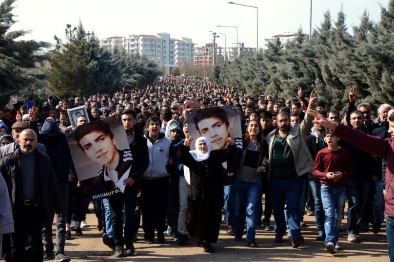 People carry the coffin of 16-year-old Mahmut Bulak, who was killed during a protest against operations in Cizre on February 9, through Diyarbakir in southeast Turkey on February 10, 2016