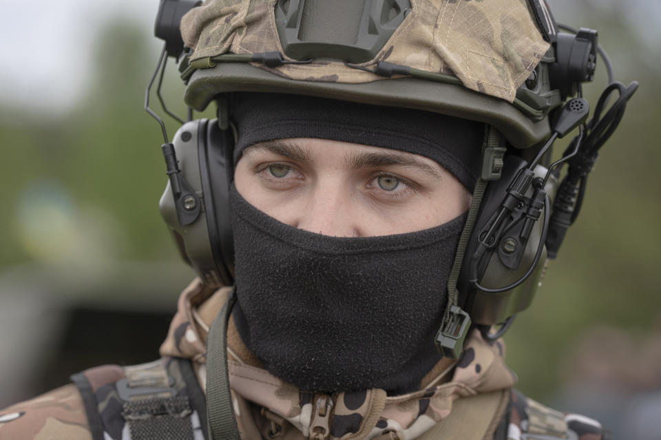 Members of a Ukrainian air-defense unit demonstrate their work near Kyiv on Monday, May 8, 2023. From camouflaged positions, the units dart out by truck into the farm fields around the capital, ready to take down enemy drones or missiles. Since Russia resumed regular air attacks on April 28, the units have a perfect score, intercepting every drone and missile shot at the capital. (AP Photo/Andrew Kravchenko)