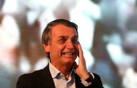 FILE PHOTO - Presidential candidate Jair Bolsonaro attends a rally in Porto Alegre, Brazil August 30, 2018. Picture taken August 30, 2018. REUTERS/Diego Vara