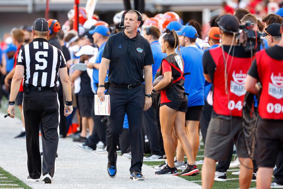 Aug 31, 2023; Salt Lake City, Utah, USA; Florida Gators head coach Billy Napier works the sideline in the first half against the Utah Utes at Rice-Eccles Stadium. Mandatory Credit: Jeff Swinger-USA TODAY Sports