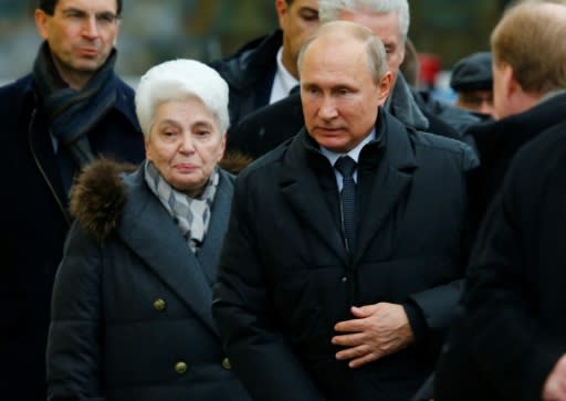 Russian President Vladimir Putin and Alexander Solzhenitsyn's widow Natalia attend the unveiling ceremony of a statue of the Russian writer and dissident who Putin said "never permitted malicious talk of his homeland"