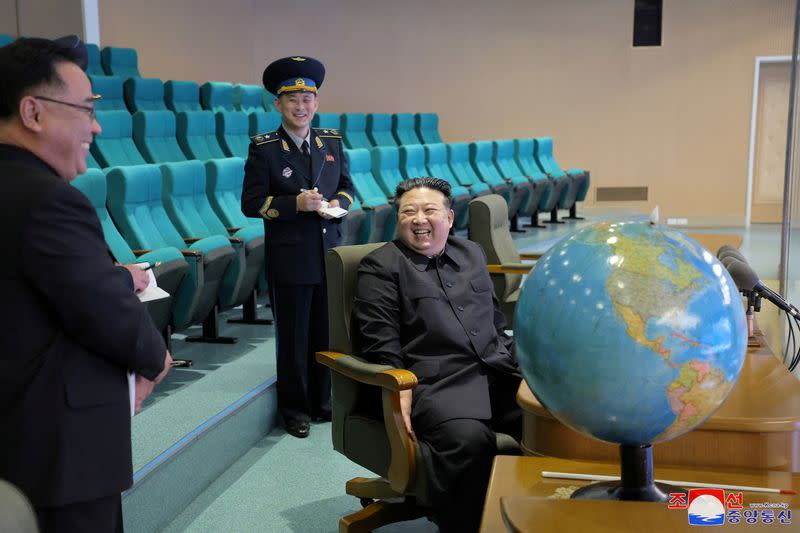 FILE PHOTO: North Korea's Kim inspects new spy satellite photos of 'target regions'