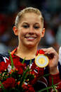 Gold medalist Shawn Johnson of the USA poses on the podium during the medal ceremony for the Women's Beam Final at the National Indoor Stadium on Day 11 of the Beijing 2008 Olympic Games on August 19, 2008 in Beijing, China.