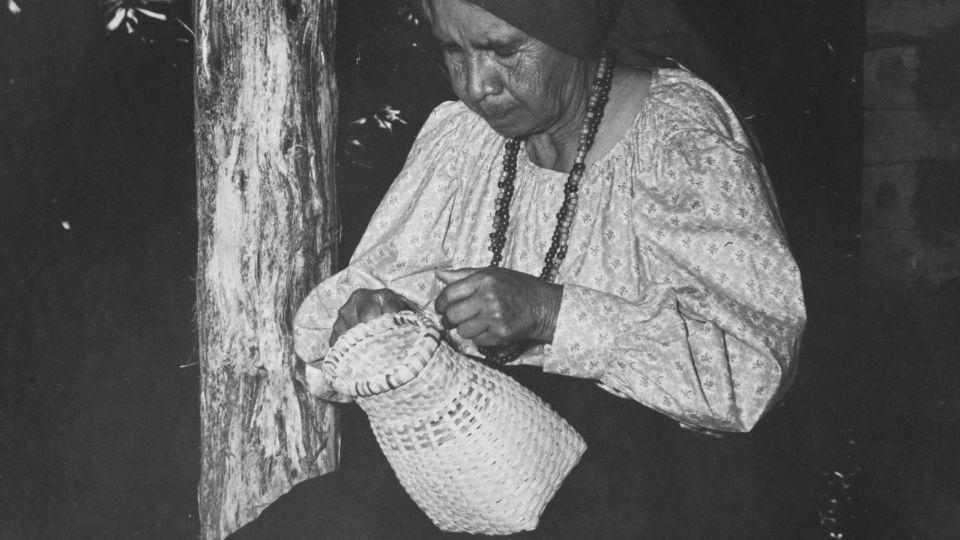 Molly Sequoyah of the Cherokee Nation makes a handmade basket with white oak slats in North Carolina circa 1940. - FPG/Archive Photos/Getty Images