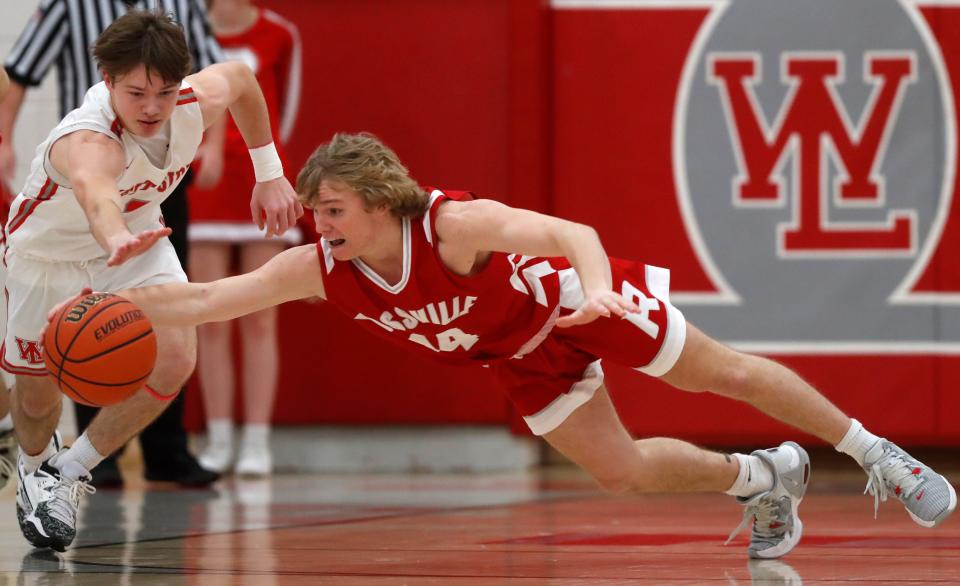 West Lafayette Red Devils guard Benny Speaker (3) and Rossville Hornets guard Austin Bray (14) dive for a loose ball during the IHSAA boys basketball game, Friday, Feb. 24, 2023, at West Lafayette High School in West Lafayette, Ind. West Lafayette won 66-46.