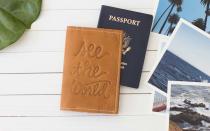 Make passport protection cuter with this handmade passport cover. The leather is embossed with a see the world design and can be personalized with initials or a name, as well.To buy: $25; etsy.com