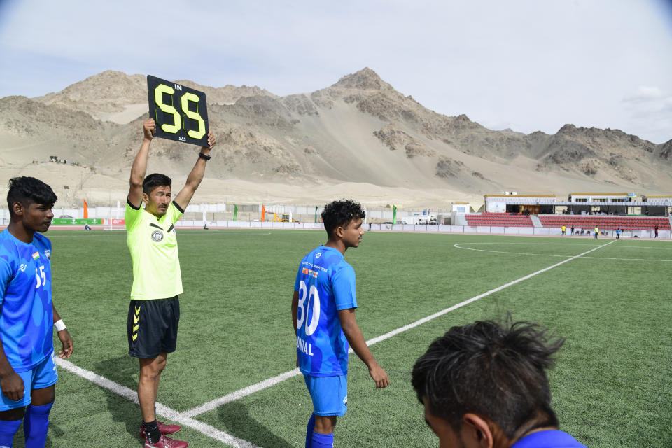 A player substitution in progress during “climate cup” a first of its kind “climate-friendly” soccer tournament on the outskirts of Leh, Ladakh, India, Tuesday, Sept.5, 2023. The organizers say the matches are first in Asia to be held at an altitude of 11,000 feet, about 3,350 meters, and with a minimum carbon footprint. Ladakh is an ecologically fragile territory where oxygen is thin, and breathing is hard. (AP Photo/Stanzin Khakyab)