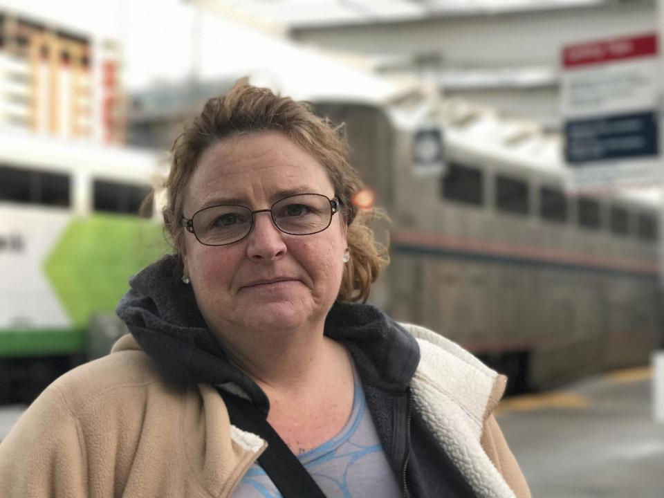 In this photo taken Wednesday, Jan. 25, 2017, in Denver, Machelle Lowe, 45, of Mount Pleasant Iowa, was traveling to see her daughter in Wyoming after discovering she has cancer. AP Tampa correspondent Tamara Lush spent 15 days traveling via train across the U.S. as part of Amtrak's residency program, designed for creative professionals to spend time writing on the rails. She spoke with dozens of people _ fellow travelers, friends and family waiting for loved one at stations, train workers _ and filed occasional dispatches for the Tales on a Train project. (AP Photo/Tamara Lush)