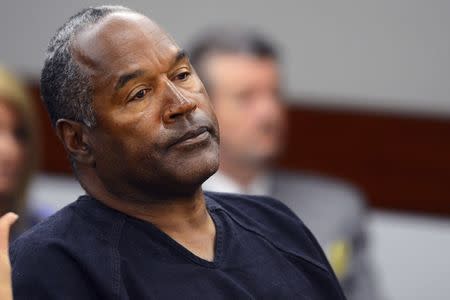 FILE PHOTO - O.J. Simpson watches his former defense attorney Yale Galanter testify during an evidentiary hearing in Clark County District Court in Las Vegas, Nevada May 17, 2013. REUTERS/Ethan Miller/Pool