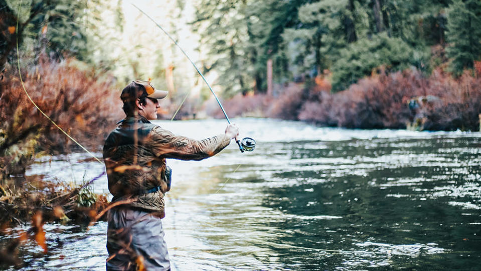 Fly-fishing in a river bank. - Credit: Greysen Johnson/Unsplash