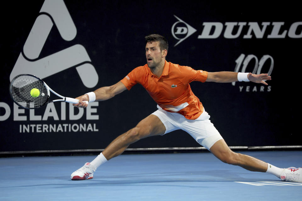 Serbia's Novak Djokovic makes a forehand return to Russia's Daniil Medvedev in the semi final match at the Adelaide International Tennis tournament in Adelaide, Australia, Saturday, Jan. 7, 2023. (AP Photo/Kelly Barnes)