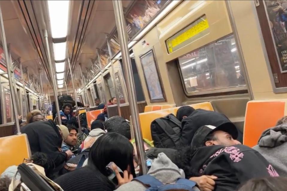 The scene of fearful straphangers riding the A train Thursday while a fight broke out between two men that led to gunshots. @JoyceMeetsWorld/X-ABC