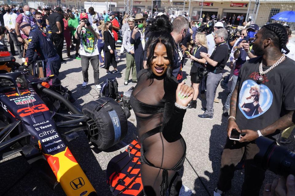 US rapper Megan Thee Stallion looks at the media in the pit lane before the Formula One United States Grand Prix at the Circuit of The Americas in Austin, Texas