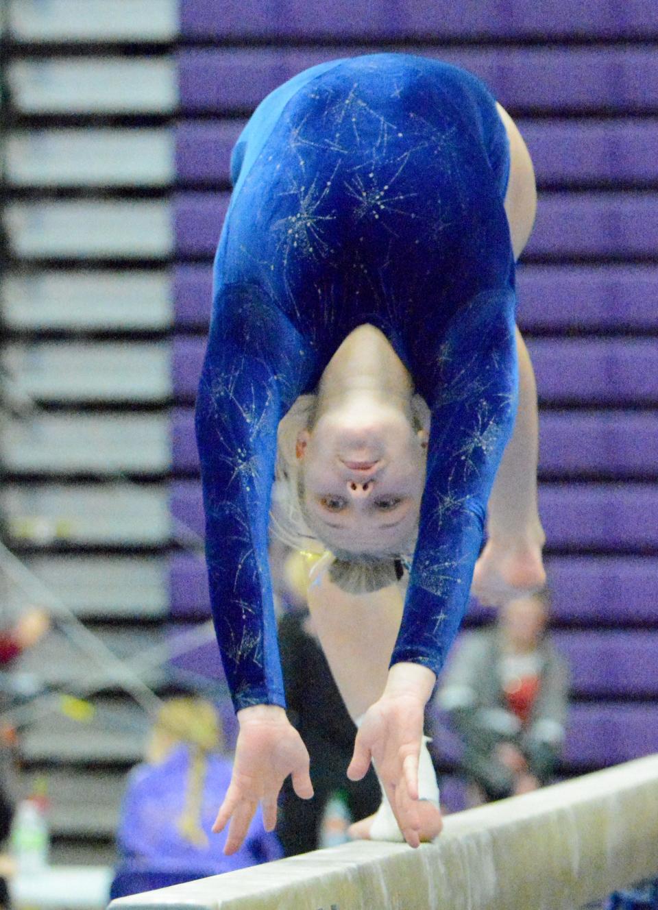 Aberdeen Central's Brecken Santjer flips on the balance beam during the Watertown Invitational gymnastics meet on Saturday, Jan. 21, 2023 in the Civic Arena.