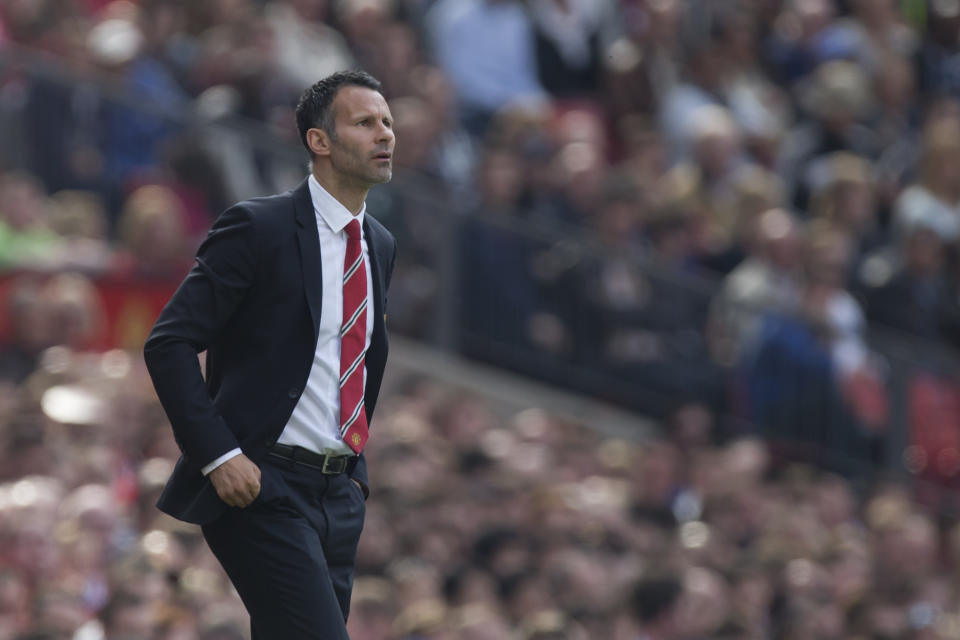 Manchester United's interim manager Ryan Giggs watches his team's English Premier League soccer match against Sunderland at Old Trafford Stadium, Manchester, England, Saturday May 3, 2014. (AP Photo/Jon Super)