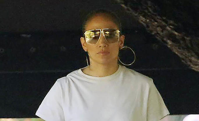 White in Monochrome Outfit + Neon Sneakers – Rvce News - valentino square  sunglasses - Jennifer Lopez Masters All